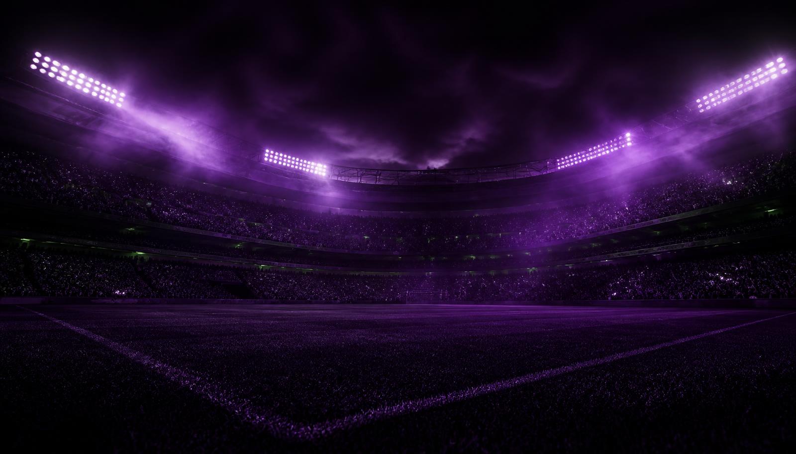 Floodlit stadium at night